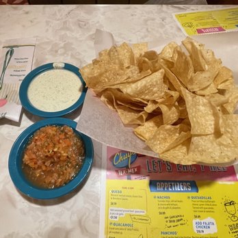 Chuy's - Chips and salsa. White sauce is ranch dressing - Mexican Near Me - Glen Allen, Virginia
