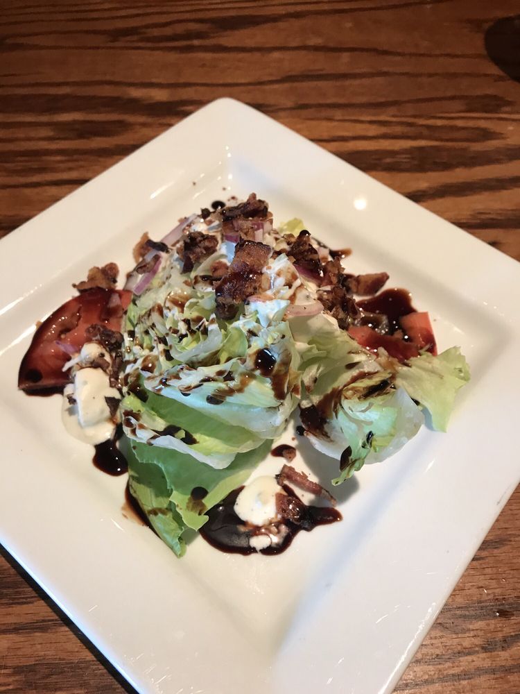 Order Iceberg Wedge & Vine Ripe Tomatoes food online from Trackside Grill store, Kennesaw on bringmethat.com
