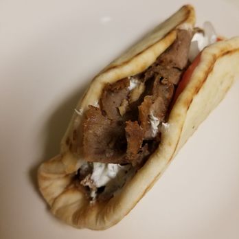 Salem's Fresh Eats - a pita sandwich on a white plate - Sandwiches Near Me - Tampa, Florida Salem's Fresh Eats - a pita sandwich on a white plate - Sandwiches Near Me - Tampa, Florida