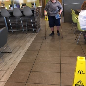 McDonald's - a woman with crutches in a restaurant - Coffee & Tea Near Me - Hudson, Florida