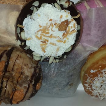 Mojo Donuts - Left: butterfinger
middle: almond joy
right: cocounut creme brulee - Donuts Near Me - Pembroke Pines, Florida Mojo Donuts - Left: butterfinger
middle: almond joy
right: cocounut creme brulee - Donuts Near Me - Pembroke Pines, Florida