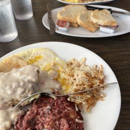 Corned beef hash and a piece of chicken fried steak from my woman Corned beef hash and a piece of chicken fried steak from my woman