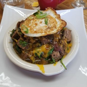 Khepera's Kitchen - Brisket with sauteed spinach and potatoes and cheese.  Topped with an egg. - Cooking Classes Near Me - Baltimore, Maryland