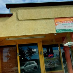Ms Joy's African Market - Nobody's inside the restaurant, empty. There is a different sign on top.