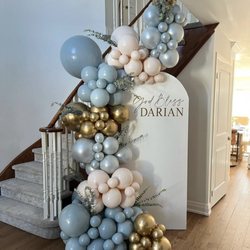 Luxe events N Y - Personalized arch backdrop with LUXE oversized stairway arch and added florals.