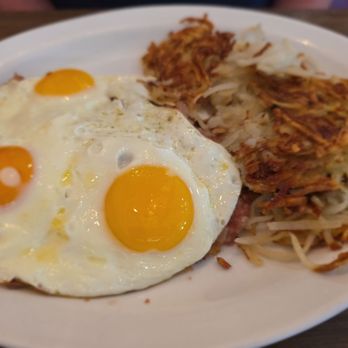 Corner Square Cafe - Eggs over cornedbeef hash. A lot of food with a side of toast. - Cafes Near Me - Woodstock, Illinois