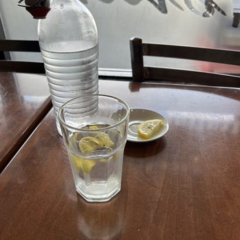 Tonino's Pizza And Panini - a bottle of water and lemon slices - Pizza Near Me - Brampton, Ontario Tonino's Pizza And Panini - a bottle of water and lemon slices - Pizza Near Me - Brampton, Ontario