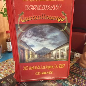 Quetzaltenango Restaurant - a person holding a book - Restaurants Near Me - Los Angeles, California Quetzaltenango Restaurant - a person holding a book - Restaurants Near Me - Los Angeles, California
