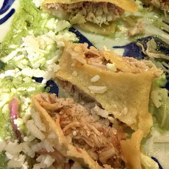 Mi Tierra Cafe & Bakery - Enchiladas Poblanos showing chicken inside (tender and flavorful) - Mexican Near Me - San Antonio, Texas Mi Tierra Cafe & Bakery - Enchiladas Poblanos showing chicken inside (tender and flavorful) - Mexican Near Me - San Antonio, Texas