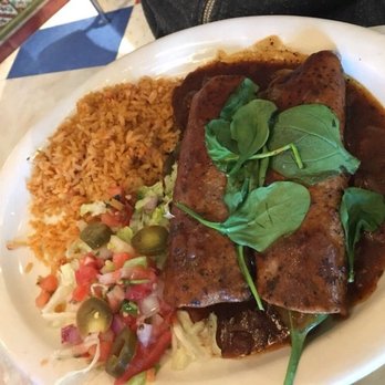 Chuy's - Vegan enchiladas (sans cheese) with ranchero sauce, and Mexican rice and charro beans. - Tex-Mex Near Me - Tulsa, Oklahoma