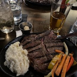 Porterhouse mashed potato's vegetable medley and cowboy butter.