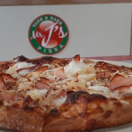 Personal size pizza with ham and pineapple Personal size pizza with ham and pineapple