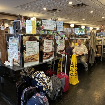 Lou Mitchell's - Interior with a place to stow your bags if you were concerned. - Breakfast & Brunch Near Me - Chicago, Illinois
