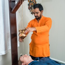 Indian Yoga Alliance - Traditional Ayurveda therapy of Shirodara for cranial nerve toning, balancing, and tension release