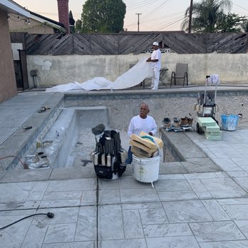 Andrew Morales & Sons Pool Plastering - Working in pool - Pool & Hot Tub Service Near Me