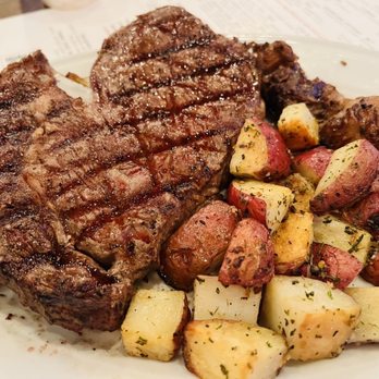 Bungalow Heights - Medium 16 oz ribeye with potatoes - Bars Near Me - Houston, Texas