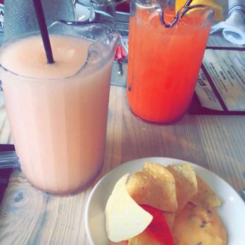 Red Stick Social - Frosé, peach drink and chips with queso. - American Near Me - Baton Rouge, Louisiana Red Stick Social - Frosé, peach drink and chips with queso. - American Near Me - Baton Rouge, Louisiana