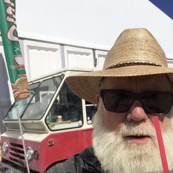 Peddler on the Path - a bearded man with a straw hat and sunglasses - Street Vendors Near Me Peddler on the Path - a bearded man with a straw hat and sunglasses - Street Vendors Near Me