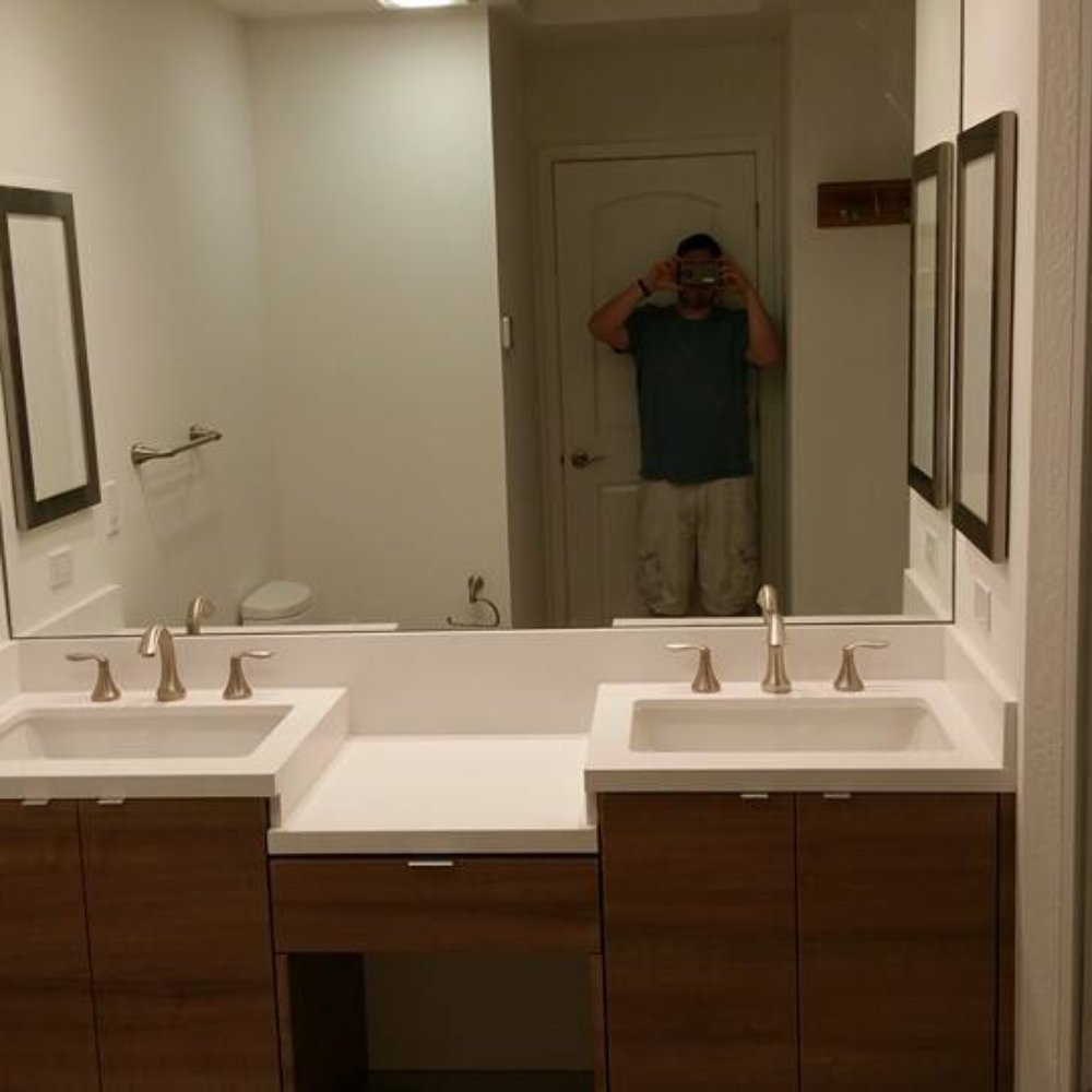 Lito's Marble & Granite - White wall to wall vanity with waterfall in the middle, all mitered edges and backsplash matching along the way. Love it! - Countertop Installation Near Me - San Jose, California Lito's Marble & Granite - White wall to wall vanity with waterfall in the middle, all mitered edges and backsplash matching along the way. Love it! - Countertop Installation Near Me - San Jose, California