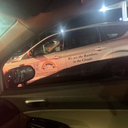 Divine Fijians Home Care - On her phone while driving a company vehicle  after almost hitting me