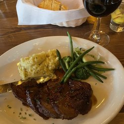 Gray Eagle Lodge - Bison Steak with mashed potatoes, mixed veggies and sauce.