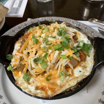 Blue Pig Tavern - Breakfast Skillet w hash brown casserole, 2 fried eggs, chorizo, peppers, and onions - New American Near Me - Cape May, New Jersey Blue Pig Tavern - Breakfast Skillet w hash brown casserole, 2 fried eggs, chorizo, peppers, and onions - New American Near Me - Cape May, New Jersey
