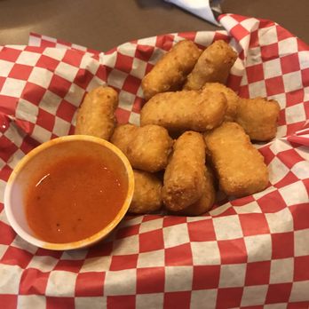 Chandler's Burger Bistro - Macaroni and cheese bites; Gouda filled, spicy pizza sauce on the side - American Near Me - Cincinnati, Ohio Chandler's Burger Bistro - Macaroni and cheese bites; Gouda filled, spicy pizza sauce on the side - American Near Me - Cincinnati, Ohio