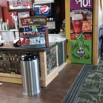 Wild Garlic - A slice and a beer for $10, fine print pepperoni or cheese with a Samuel Adams.  But you can see the taps and no Samuel Adams. - Pizza Near Me - Reno, Nevada