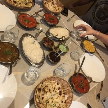 Spice India - Assortment of chicken and paneer dishes, with naan - Indian Near Me - Florence, FI
