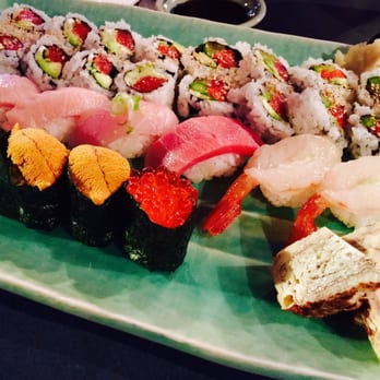Kaide Sushi - A selection of nigiri sushi (from bottom left): 2 uni, ikura, tamago, 2 toro, hamachi, blue fin tuna, amaebi. - Sushi Bars Near Me - Vancouver, British Columbia