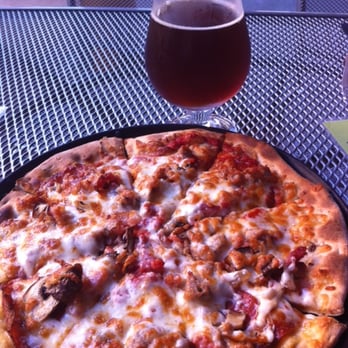 Stormcloud Brewing - Stormavore pizza with Sirius Belgian dobbel - Brewpubs Near Me - Frankfort, Michigan