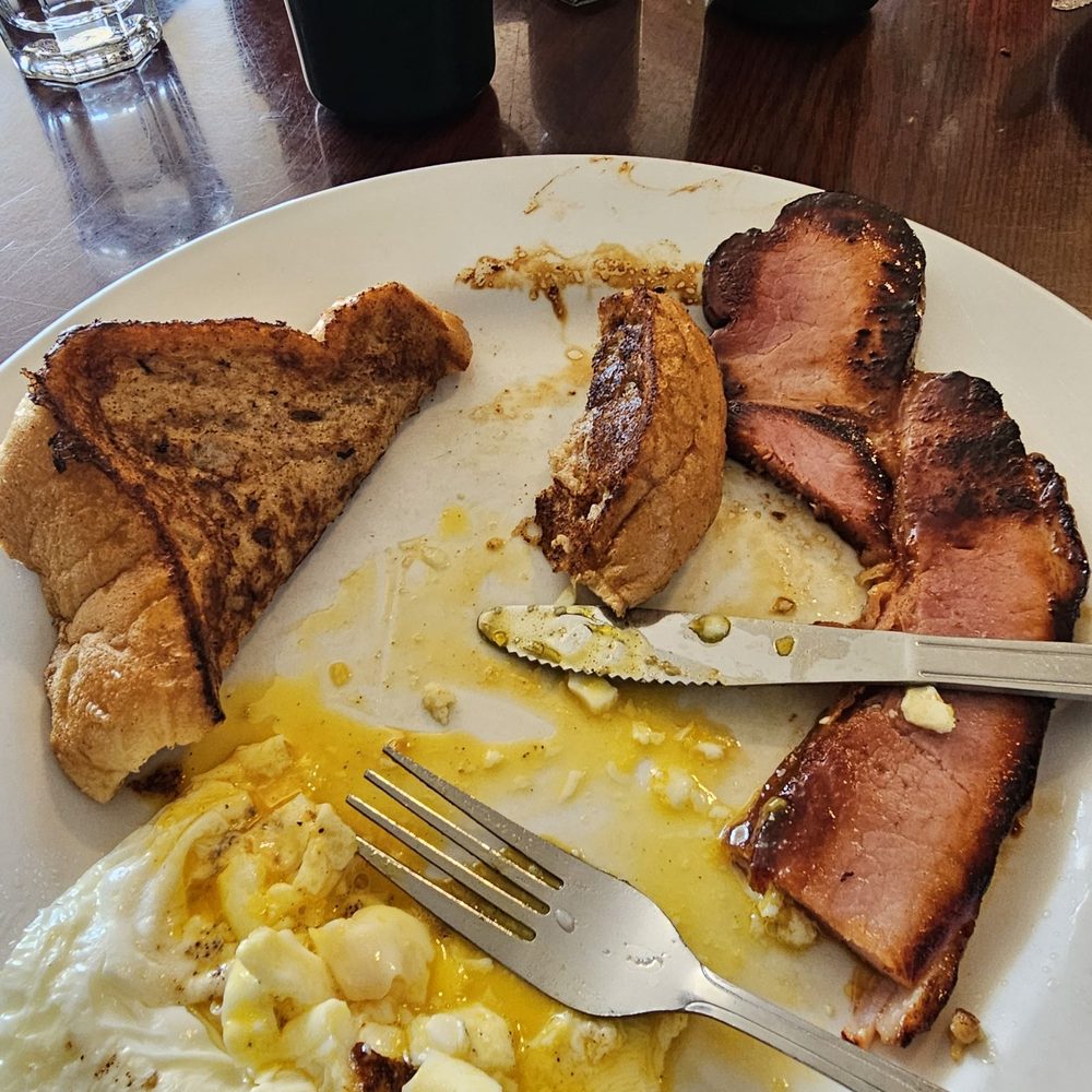 Ham (incredible), over easy eggs and French toast. Ham (incredible), over easy eggs and French toast.