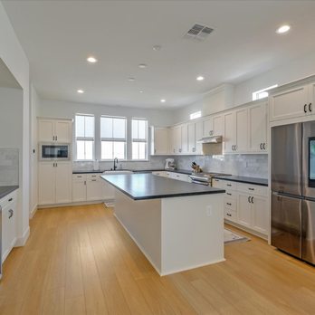 KN Construction - a kitchen with stainless steel appliances - General Contractors Near Me KN Construction - a kitchen with stainless steel appliances - General Contractors Near Me