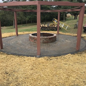 Turtle’s Mulching Service - a fire pit - Landscaping Near Me
