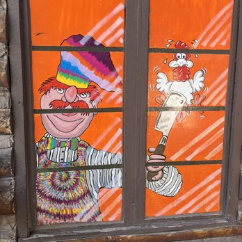 Long Wongs - a clown holding a baseball bat - Chicken Wings Near Me - Lakeside, Arizona