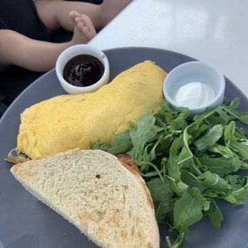 Cafe Patachou - The Omelette You Can't Refuse (bacon, white cheddar, potato, sour cream) with a side of arugula - Breakfast & Brunch Near Me - Indianapolis, Indiana Cafe Patachou - The Omelette You Can't Refuse (bacon, white cheddar, potato, sour cream) with a side of arugula - Breakfast & Brunch Near Me - Indianapolis, Indiana