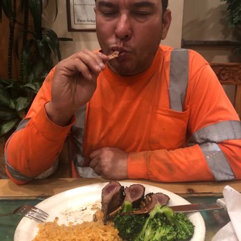 Enrique's Mexican Restaurant - He's so happy. The lamb just melts in his mouth - Mexican Near Me - Long Beach, California