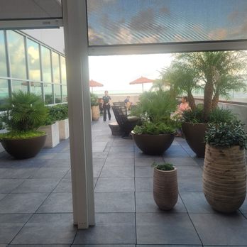 The Landing RoofTop - A view of the balcony seating, decor, and arrangement. - Comfort Food Near Me - Melbourne, Florida