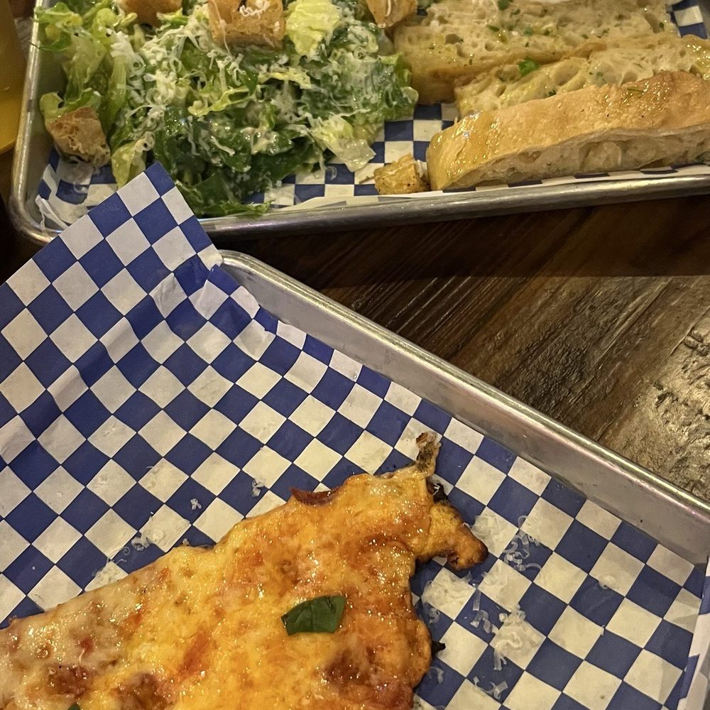 Cheese pizza slice, Caesar salad, vodka rigatoni pasta