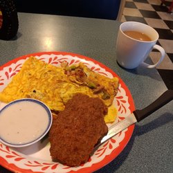The Cottage Restaurant - Western Omelette with country fried steak with country gravy on the side and coffee