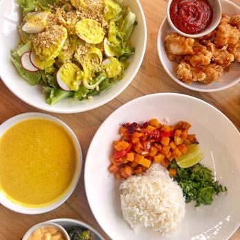 Kitava - Evolved Caesar Salad, chicken nuggets, Ginger Squash Curry, roasted brussels sprouts - New American Near Me - Oakland, California