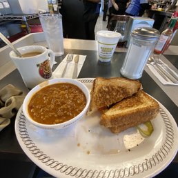 Bacon grilled cheese (added tomatoes) with small bowl of chili. Coffee and water :) Bacon grilled cheese (added tomatoes) with small bowl of chili. Coffee and water :)