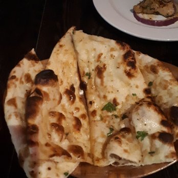 Marigold Indian Bistro - Garlic Naan (garlic and butter). - Indian Near Me - Toronto, Ontario Marigold Indian Bistro - Garlic Naan (garlic and butter). - Indian Near Me - Toronto, Ontario
