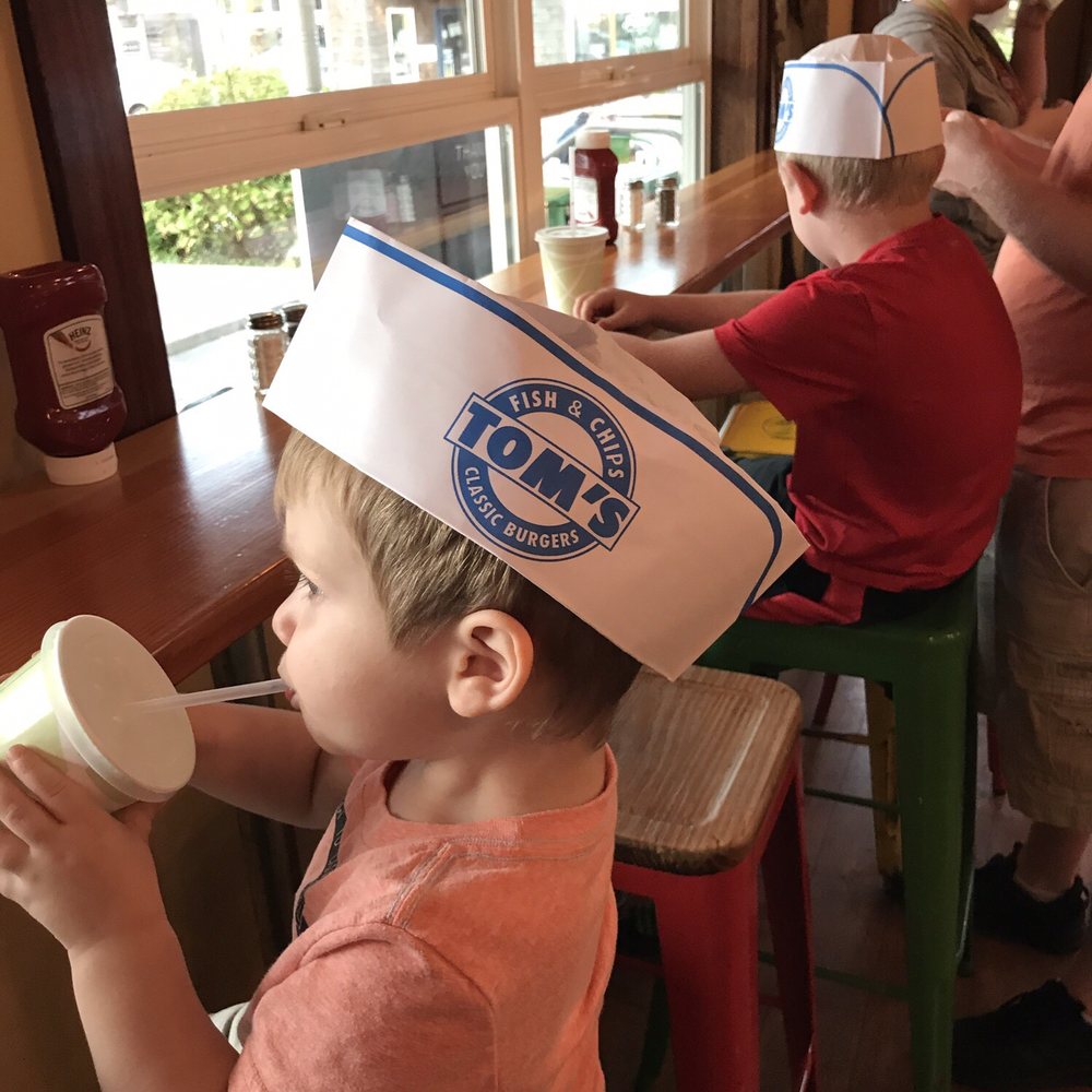 Tom's Fish N Chips - Complimentary hats with your meal for the kiddos - Burgers Near Me - Cannon Beach, Oregon Tom's Fish N Chips - Complimentary hats with your meal for the kiddos - Burgers Near Me - Cannon Beach, Oregon