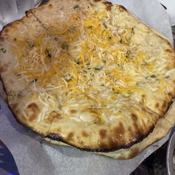 Tadka Indian Cuisine - Cheese Naan and garlic naan underneath - Indian Near Me - Honolulu, Hawaii Tadka Indian Cuisine - Cheese Naan and garlic naan underneath - Indian Near Me - Honolulu, Hawaii