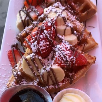 Millie's Cafe - Nutella strawberry & banana Belgium waffles with powder sugar. - Breakfast & Brunch Near Me - Los Angeles, California Millie's Cafe - Nutella strawberry & banana Belgium waffles with powder sugar. - Breakfast & Brunch Near Me - Los Angeles, California