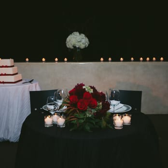 Sarah Padilla Designs - Table setting with backlit candle row arrangement. - Florists Near Me