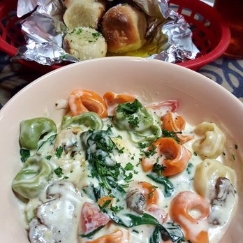 Carmella's Ristorante - Tortellini a la Carmella with Garlic Knots - absolutely mouth watering!! The Alfredo is so creamy and fresh! - Italian Near Me - Grenada, Mississippi Carmella's Ristorante - Tortellini a la Carmella with Garlic Knots - absolutely mouth watering!! The Alfredo is so creamy and fresh! - Italian Near Me - Grenada, Mississippi