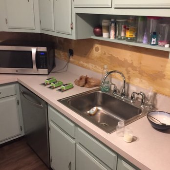 NJ Giant Construction - a kitchen with a sink and a microwave - General Contractors Near Me NJ Giant Construction - a kitchen with a sink and a microwave - General Contractors Near Me