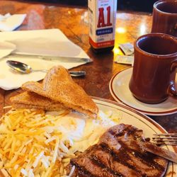 The Americana Diner - 2/27/23 6 oz ribeye medium rare. Just a splash of A1 2 eggs O/M hash browns light white toast Cawfee Excellent today